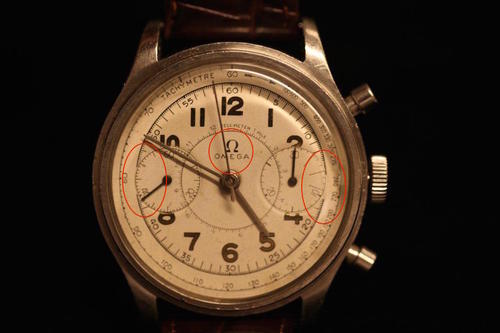 An Omega with a refinished dial offered at Christie's in New York earlier this month. Notice the imperfect Omega logo and text, the poor quality of the printing overall, and the way the track does not uniformly touch the minute register.
