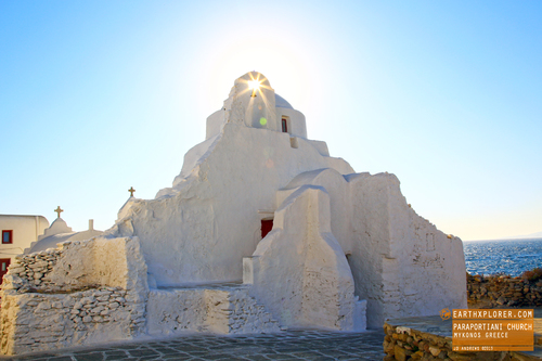 In Mykonos, almost all buildings are white washed. It's used to reflect sunlight keeping them cool.