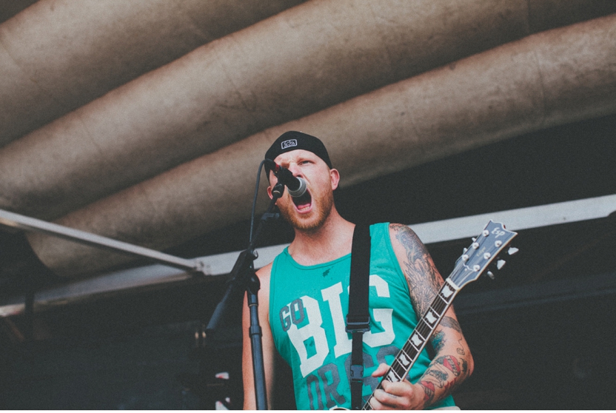 Aaron Brooks of The Ghost Inside plays at Vans Warped Tour 2012 in Dallas, Texas.