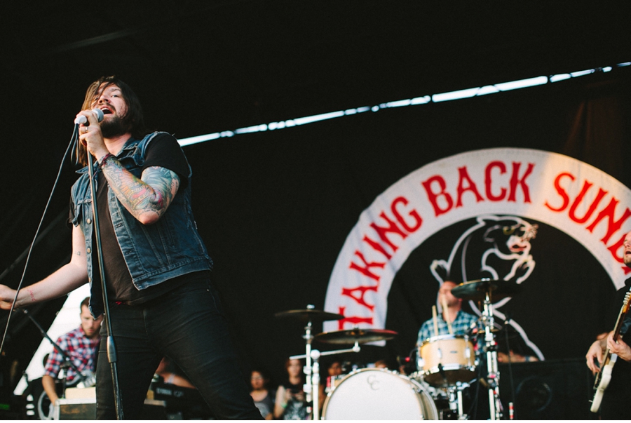 Adam Lazzara performs with Taking Back Sunday at Vans Warped Tour 2012 in Dallas, Texas.