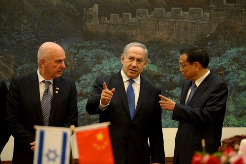 Click photo to download. Caption: Israeli Prime Minister Benjamin Netanyahu (center) talks to China's Premier Li Keqiang (right) during a signing ceremony at the Great Hall of the People in Beijing on May 8, 2013. Netanyahu is one of several Israeli leaders to make recent trips to China to nurture the Israeli-Chinese relationship, which just got another boost in the form of magnate Li Ka-Shing’s $130 million to Israel’s Technion University. Credit: Avi Ohayon/GPO/FLASH90.