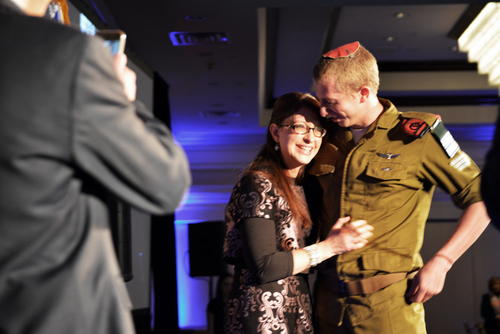 Moshe, a "lone soldier" in the Israel Defense Forces, surprises his mother Sharon at the recent northern New Jersey gala of Friends of the Israel Defense Forces. Credit:Â Richard Yumang.