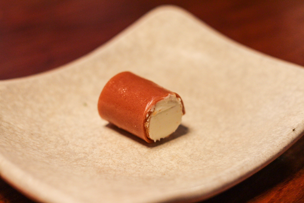 Queso - Quince Paste Cigar with Whipped Goat's Milk Cheese. ($4.00)