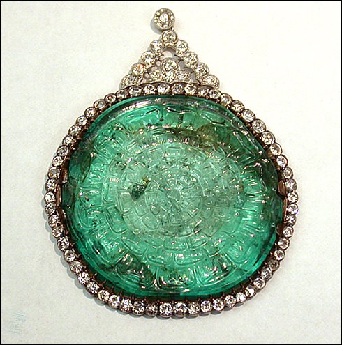 This carved flat emerald is set in a platinum, gold, and diamond pendant necklace. The emerald was discovered in Colombia, possibly by Spanish conquistadors, and found its way to India for cutting. Smithsonian, photography by Ken Larsen.