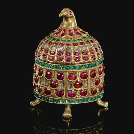 An Indian gem-set gilt-metal casket with bird-head finial. Mughal, India. Photo: Sotheby's