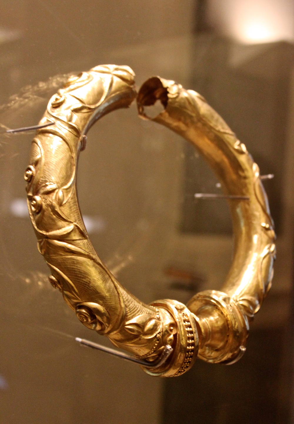 The Broighter Gold Collar. Concentric arches drawn by compass highlight raised decoration of S-shaped scrolls, trumpet shapes and lentoids. From the hoard of gold objects. Broighter, county Derry. 1st century BC.  