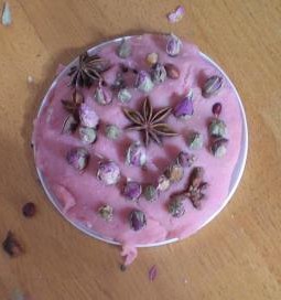 Flowers, spices and berries pressed into a base of lavender scented playdough for a calming, centering activity.  