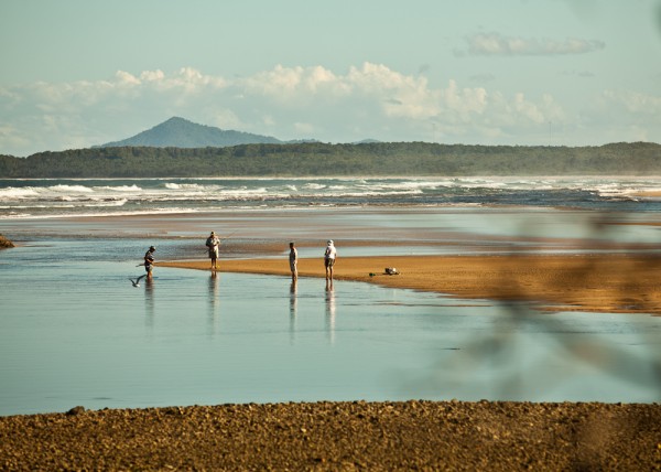 fisherman at the beach in sawtell by simon pollock