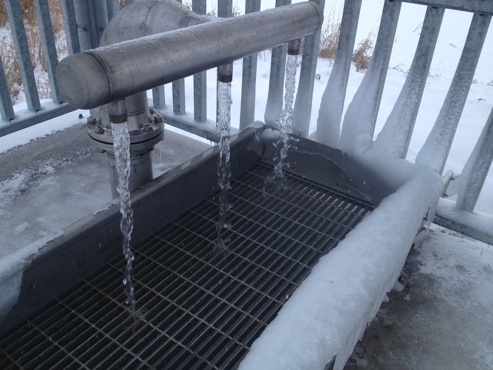 After an investment from Springwater Township, the new Elmvale Spring flow is split into three downspouts. The flow is so strong it fills your bottles faster than you can cap and carry them.
