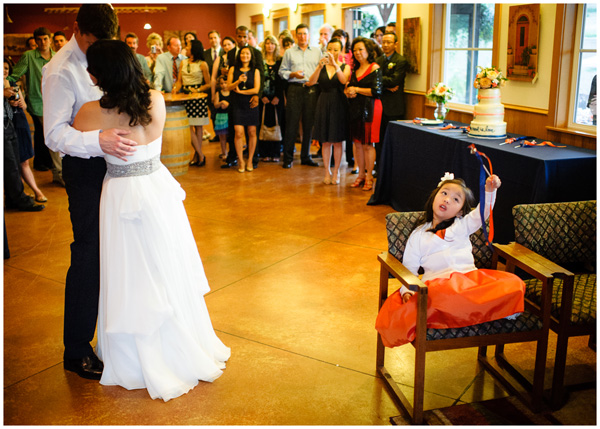 flower girl playing during first dance