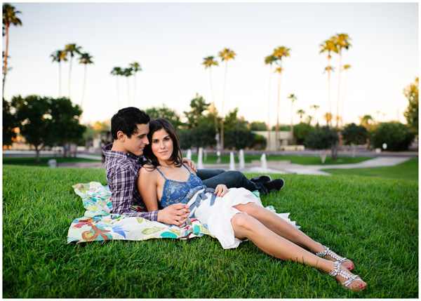 couple on grass in phoenix arizona engagement photo