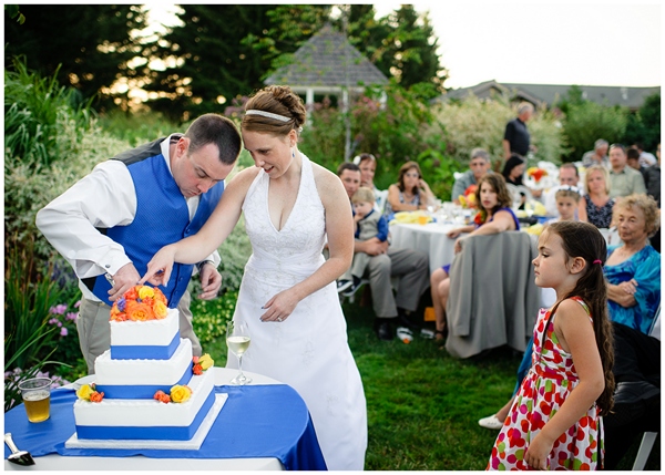 cutting the cake with girl watching