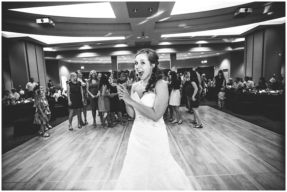 Bride throwing her bouquet at Scott Conference Center Omaha