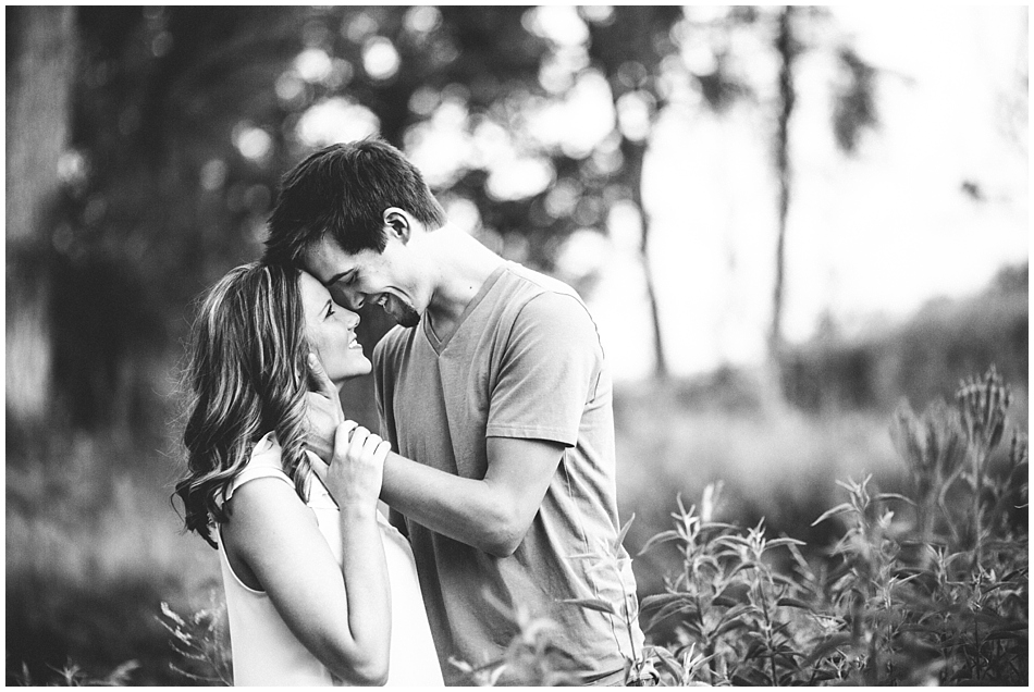 Happy couple on engagement shoot, black and white photo
