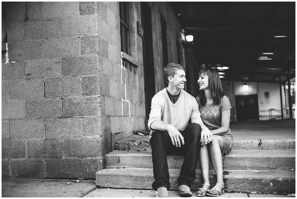 Cute couple hanging out on step in downtown Omaha, Nebraska