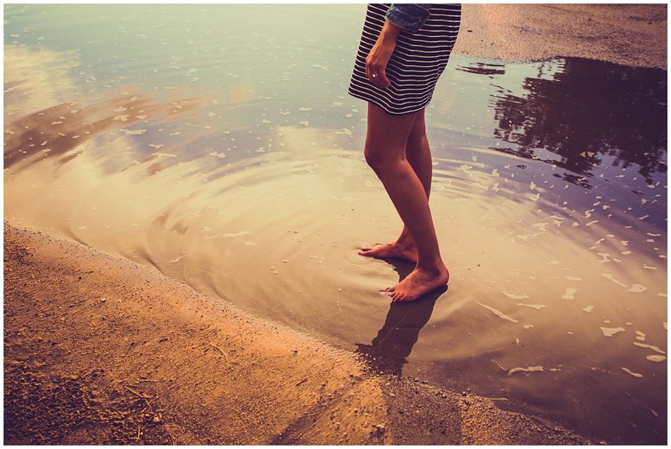 girl standing in a puddle