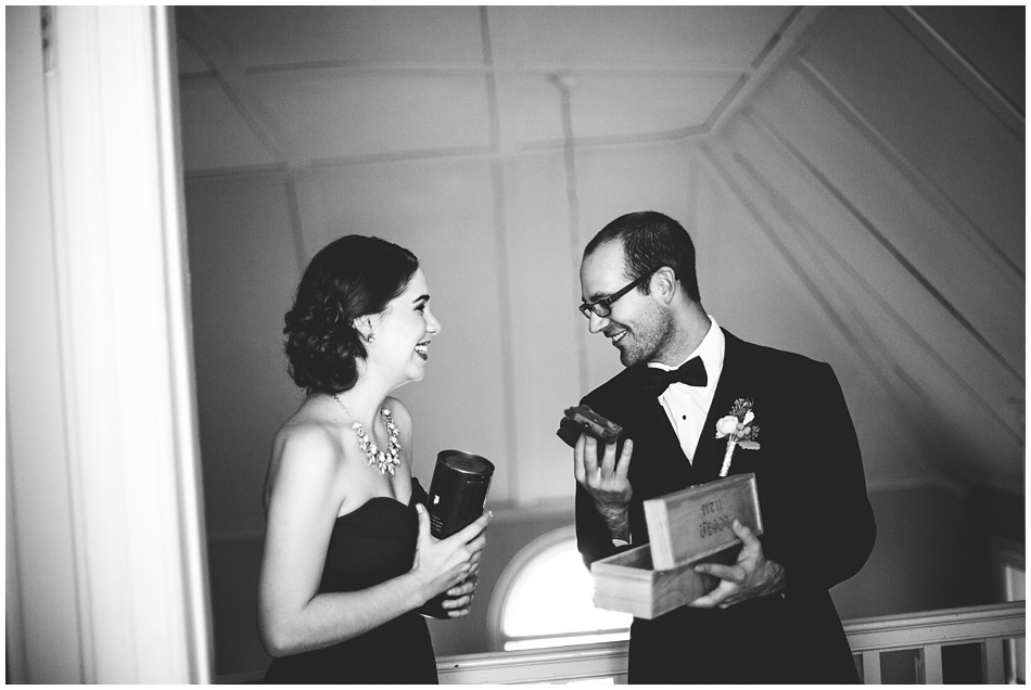 Groom opening gift from his bride