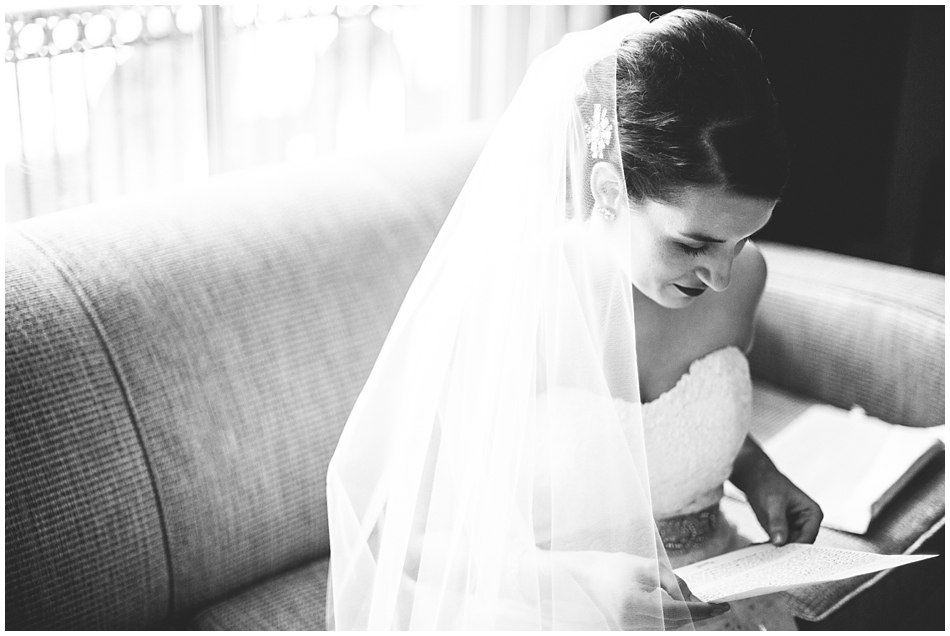 Bride reading letter in Magnolia hotel, Omaha, NE