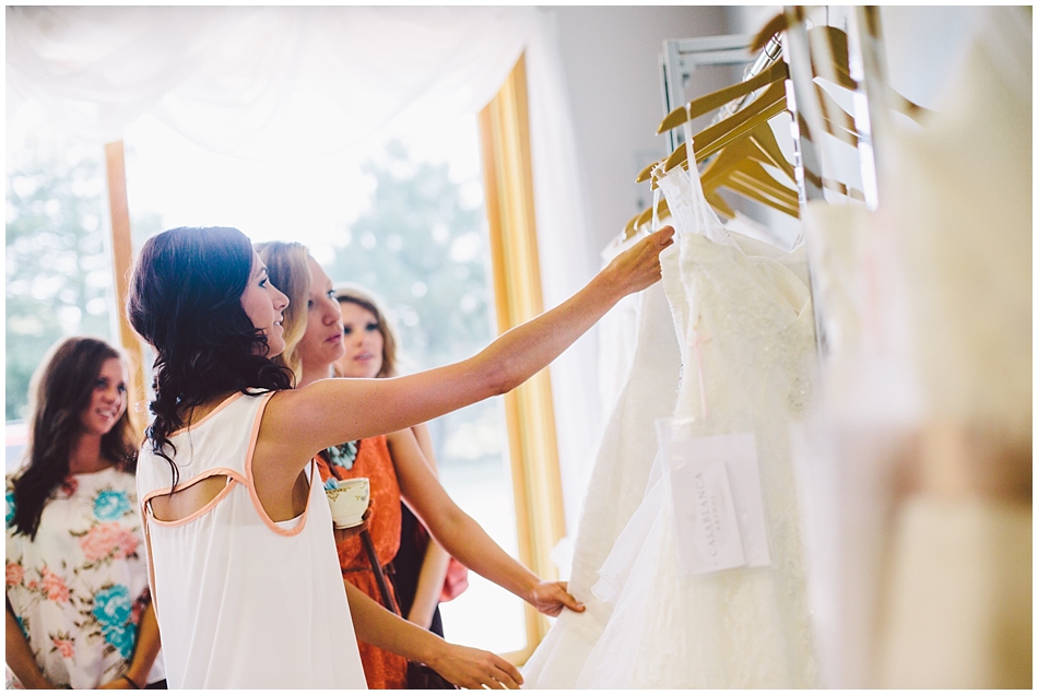 Bride picking out wedding dresses, photo by Amanda Kohler Photography