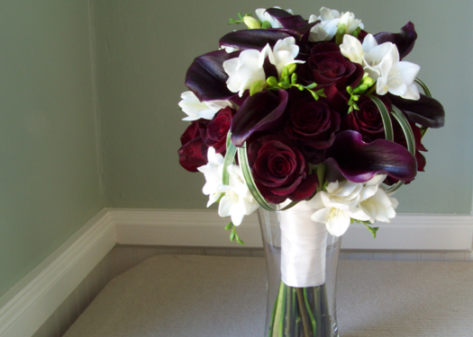 bridal bouquet with Black Baccara roses, Schwartzwalder mini callas, freesia and loops of lily grass
