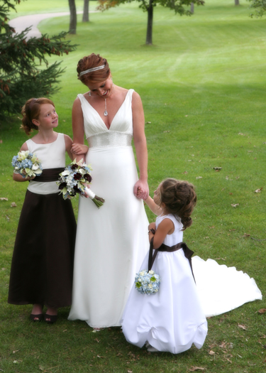 the bride with the junior bridesmaid and the flower girl