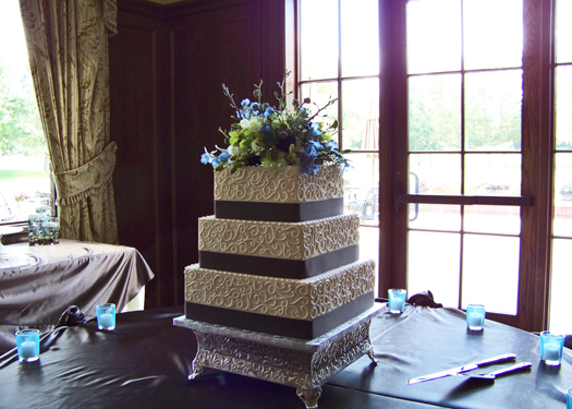 cake by the Sweet and Savory Bake Shop with a topper from Floral Verde LLC
