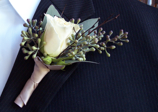 boutonniere with one Cream Prophyta rose, seeded eucalyptus, bamboo sprigs, and oatmeal satin ribbon