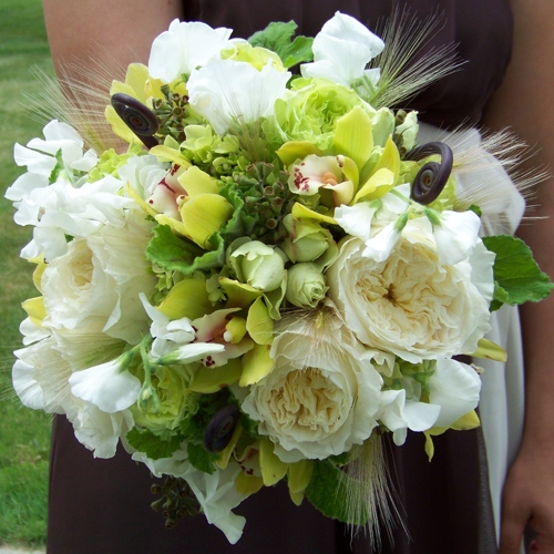 bridesmaid bouquet with white sweet peas, Patience garden roses, fern curls, green hydrangea, green mini cymbidiums, scented geranium, native grasses, seeded eucalyptus, Super Green roses, and green minou spray roses