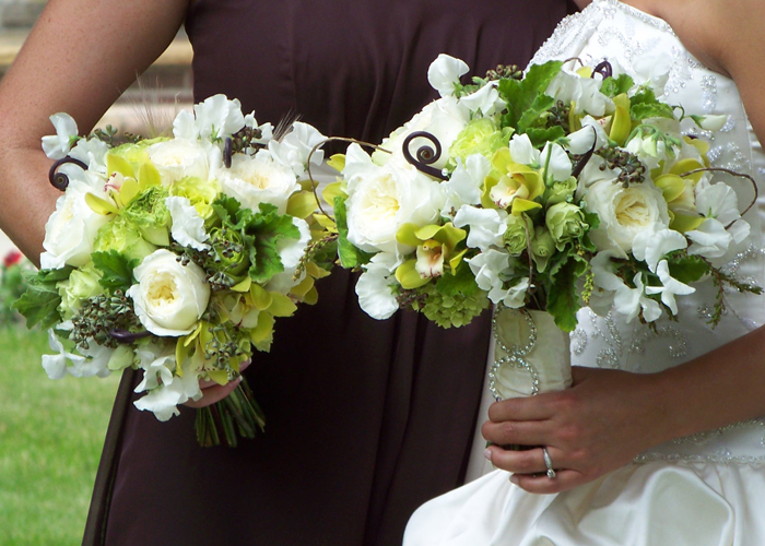 green and ivory bouquets with sweet peas, Patience garden roses, fern curls, curly willow, pieris buds, green hydrangea, green mini cymbidiums, scented geranium, seeded eucalyptus, Super Green roses, and green minou spray roses