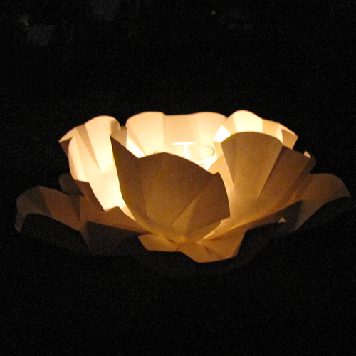 large ivory paper peony pool float with candle