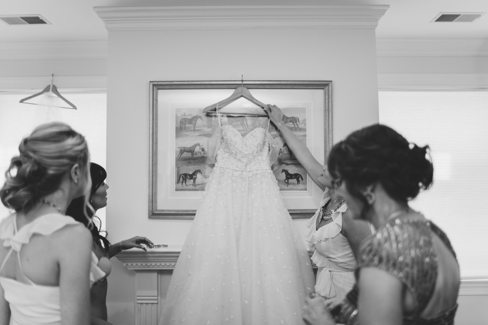 Bride getting into her Christos Wedding Dress for wedding at Terrain at Styers, Glen Mills Pennsylvania, Hair/Makeup: Beautiful Brides Philly, Philadelphia Wedding Photographers With Love & Embers