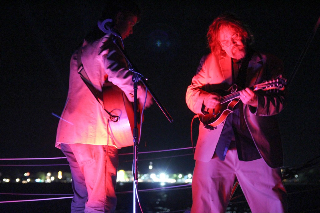 Billy Strings and Don Julin on the Nauticat sailboat in Grand Traverse Bay