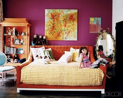 By mixing the fun pink with tangerine tones and neutrals, this room uses the beautiful fall colors in a way that doesn't make this room feel overwhelming.  Photo courtesy elledecor.com.