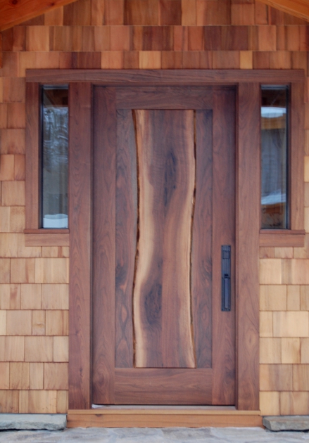 The live edge of the center stave of this walnut door 