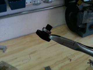 See the nub? It's what I'm holding onto with the wire cutters.