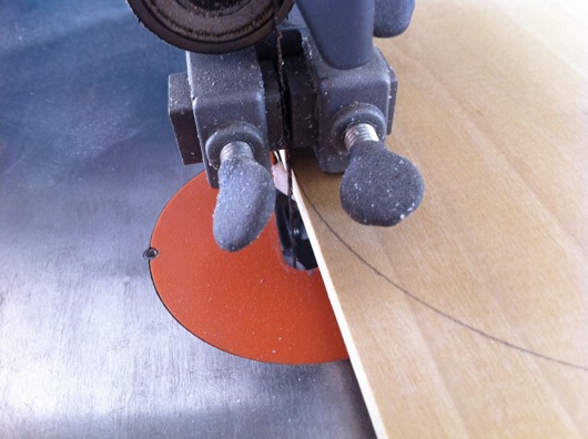 Bandsaw blade against circle to cut