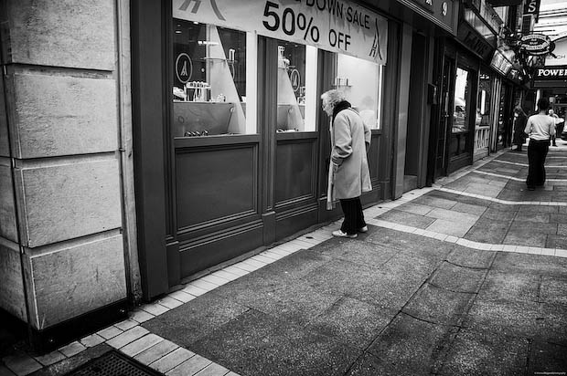 Elderly Woman Looks In a Store