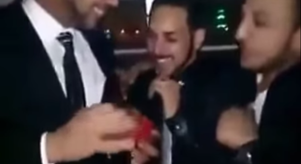 Screengrab of two men exchanging rings in what is likely Egypt's first gay wedding. (YouTube)