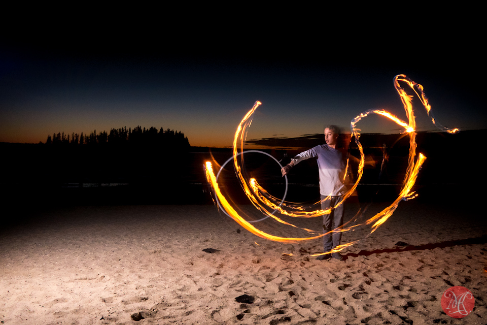 beach sunset fire performer