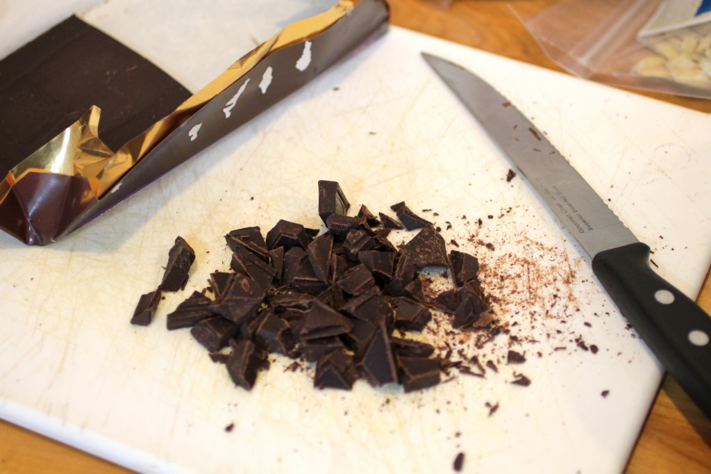 cutting unsweetened chocolate for delicious granola bars