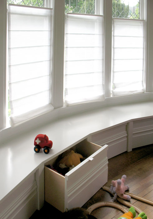 new bench seat following the big bay window, with concealed storage for kids' 