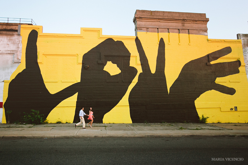 Engaged in front of a Baltimore Love Project mural by Maria Vicencio Photography