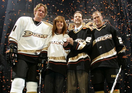 Team mascot Wild Wing points at Anaheim Ducks owners Susan Samueli and  her husband Henry Samueli as they unveil the club's new logo and jerseys  Wednesday, June 22, 2006, at the Arrowhead