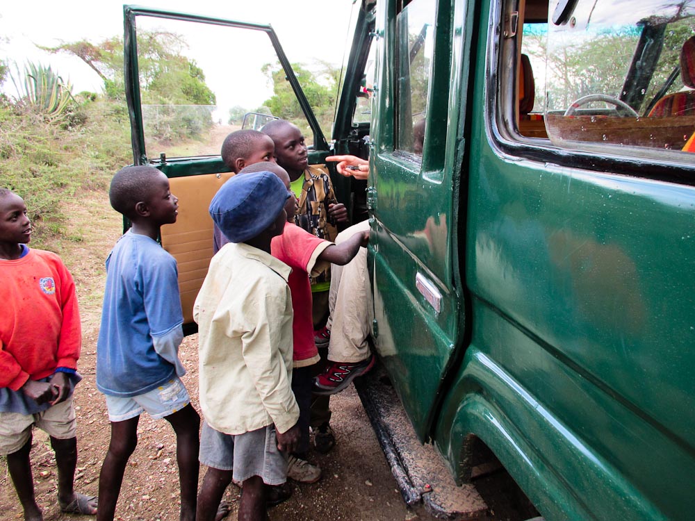 Kenyan children surrounding the truck