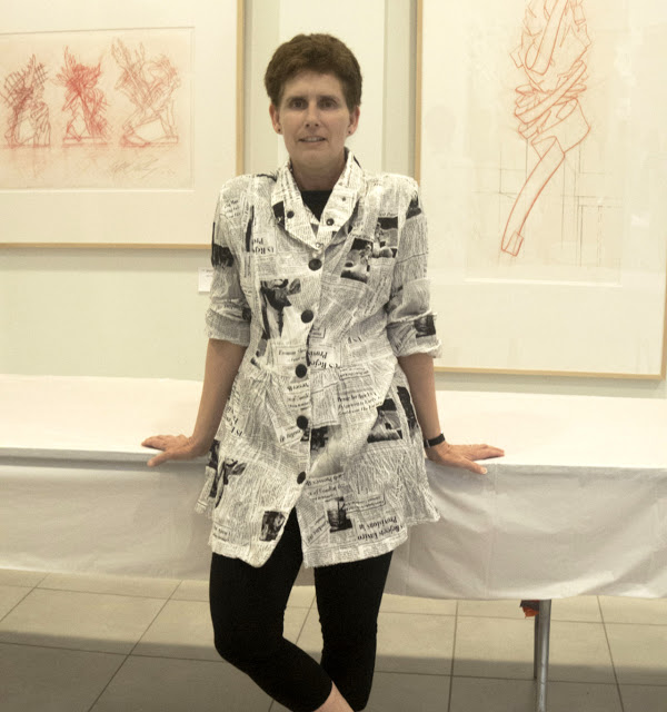 RIT Associate Professor of Design Lorrie Frear wears a newspaper print shirt 