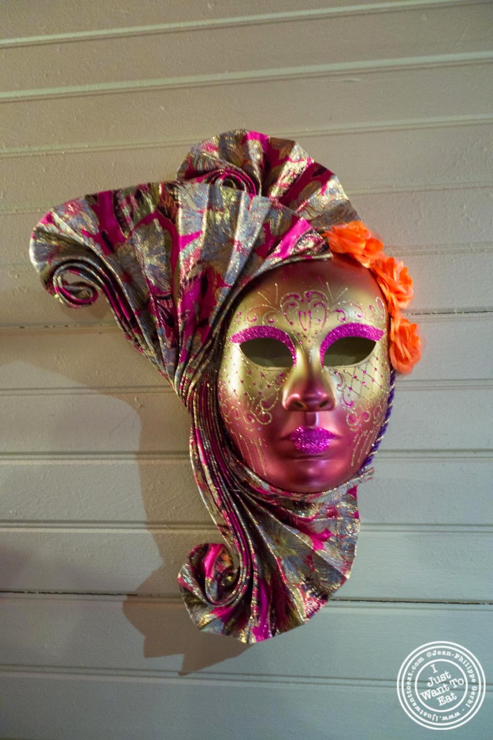 image of Mardi gras mask at MASQ New Orleans inspired cuisine in NYC, New York