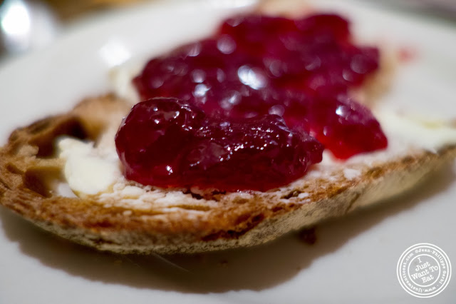 image of wheat bread with red berries jam at Le Pain Quotidien in NYC, New York