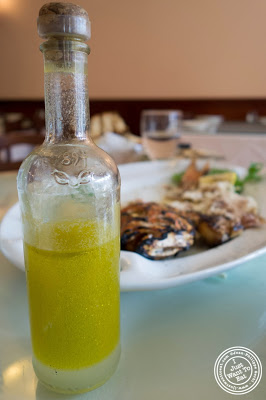 image of olive oil and lemon for Red snapper at Telly's Taverna in Astoria, New York