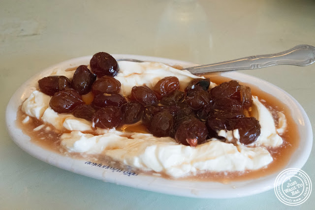 image of Greek yogurt with preserved grapes at Telly's Taverna in Astoria, New York
