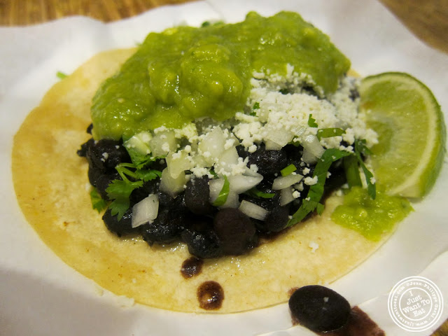 image of black bean taco with guacamole at Pinche Taqueria in NYC, New York